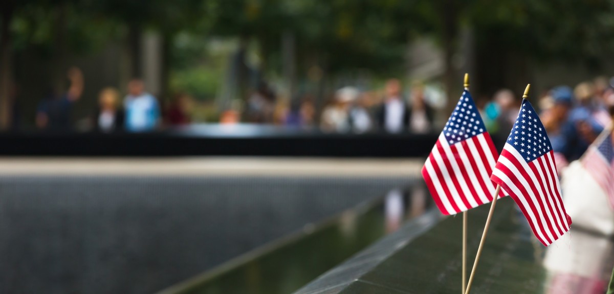 two american flags sitting at the 9/11 memorial site