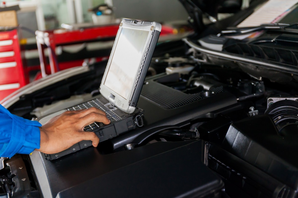 mechanic running diagnostics on a vehicle